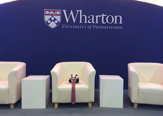 SeekPanda's mascot MJ on stage during a quiet moment at the Wharton Global Forum Beijing.